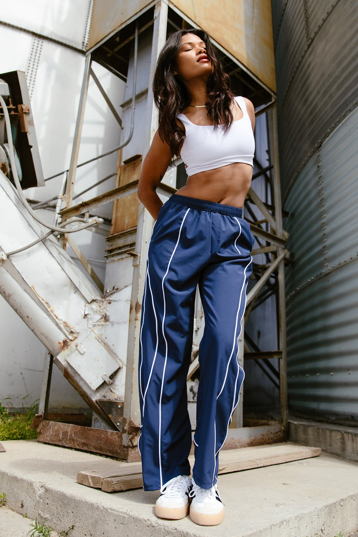 Girl in track pants sale